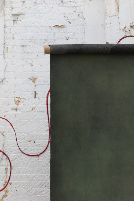 detail of hand painted green canvas backdrop