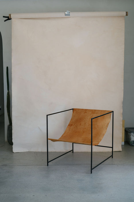 Subtle textures backdrop custom hand painted on a c-stand with a vice grip and leather chair at La Chacuel. Image by Anya Kernes.