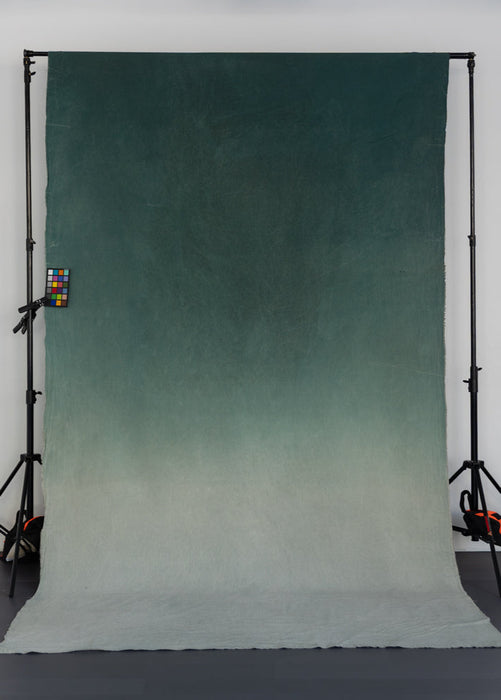 turquoise gradient backdrop on backdrop stand