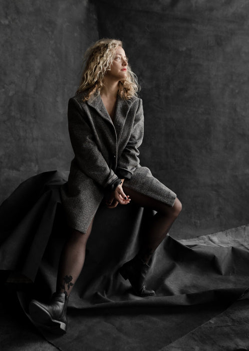 Vintage Black backdrop by Ultraviolet layered with blonde woman sitting on covered apple boxes. Image by Steph Kirk.