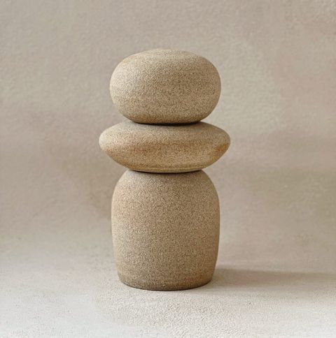 Katherine Moes ceramics against Ultraviolet Backdrops mineral textured backdrop with white, cream, and sandy tones and textures.