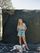 Blonde woman and dalmation stand on Ultraviolet Backdrops black muslin Backdrop in a Bag. Portable, lightweight, easy to use backdrop, huge muslin. Image shot by Logan Potterf on Kodak Gold 120 film. 