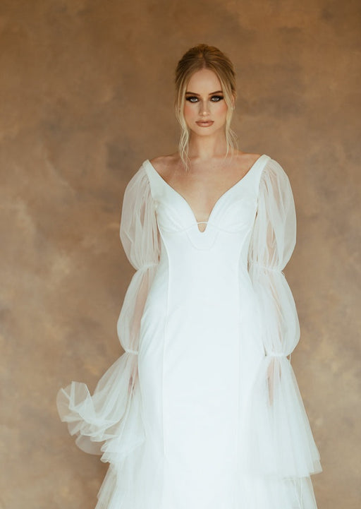 bride in white gown with brown and gray backdrop