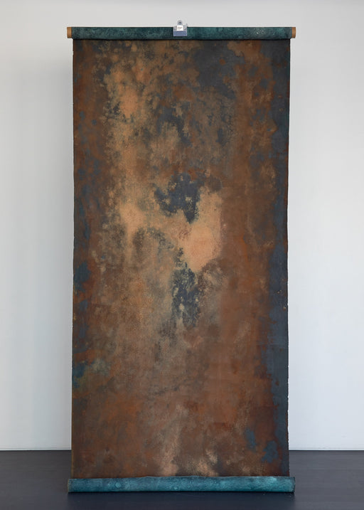 Rust textures on a teal canvas backdrop