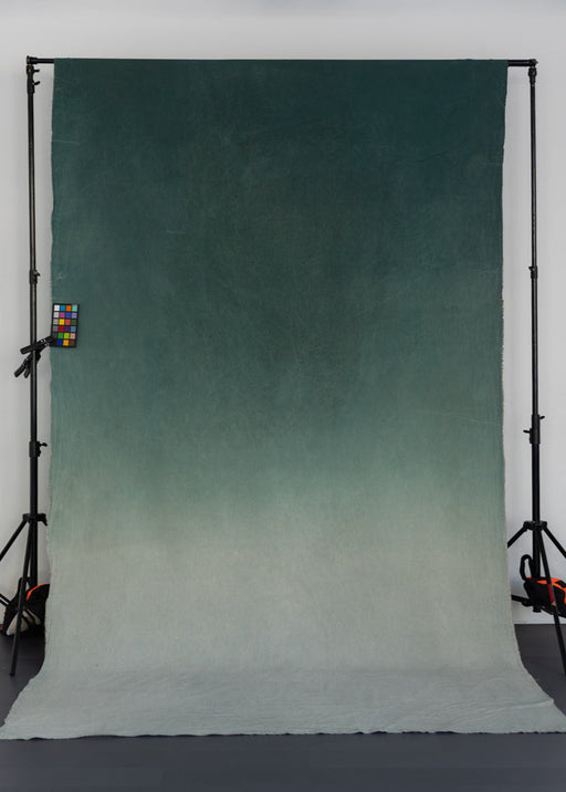 turquoise gradient backdrop on backdrop stand