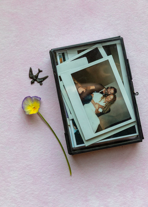 polaroid box on styled flaylat surface by ultraviolet backdrops