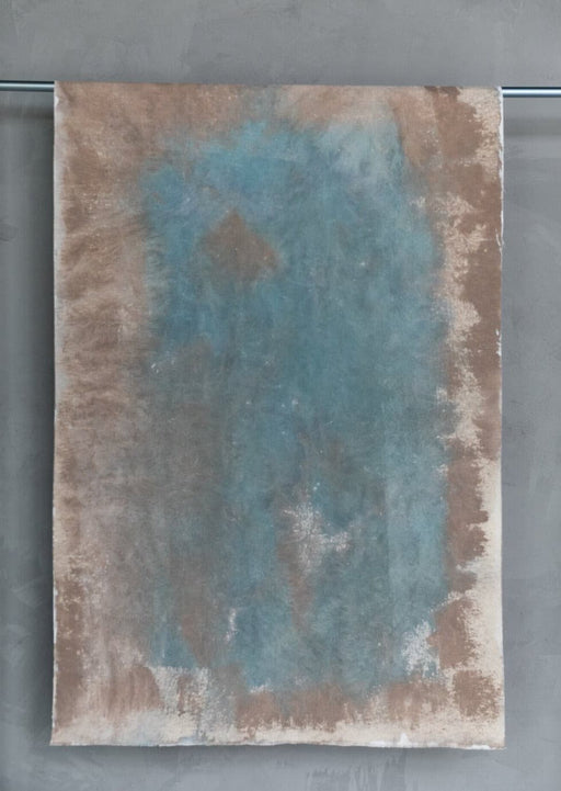 Like water and earth: abstract light brown and teal painted canvas.